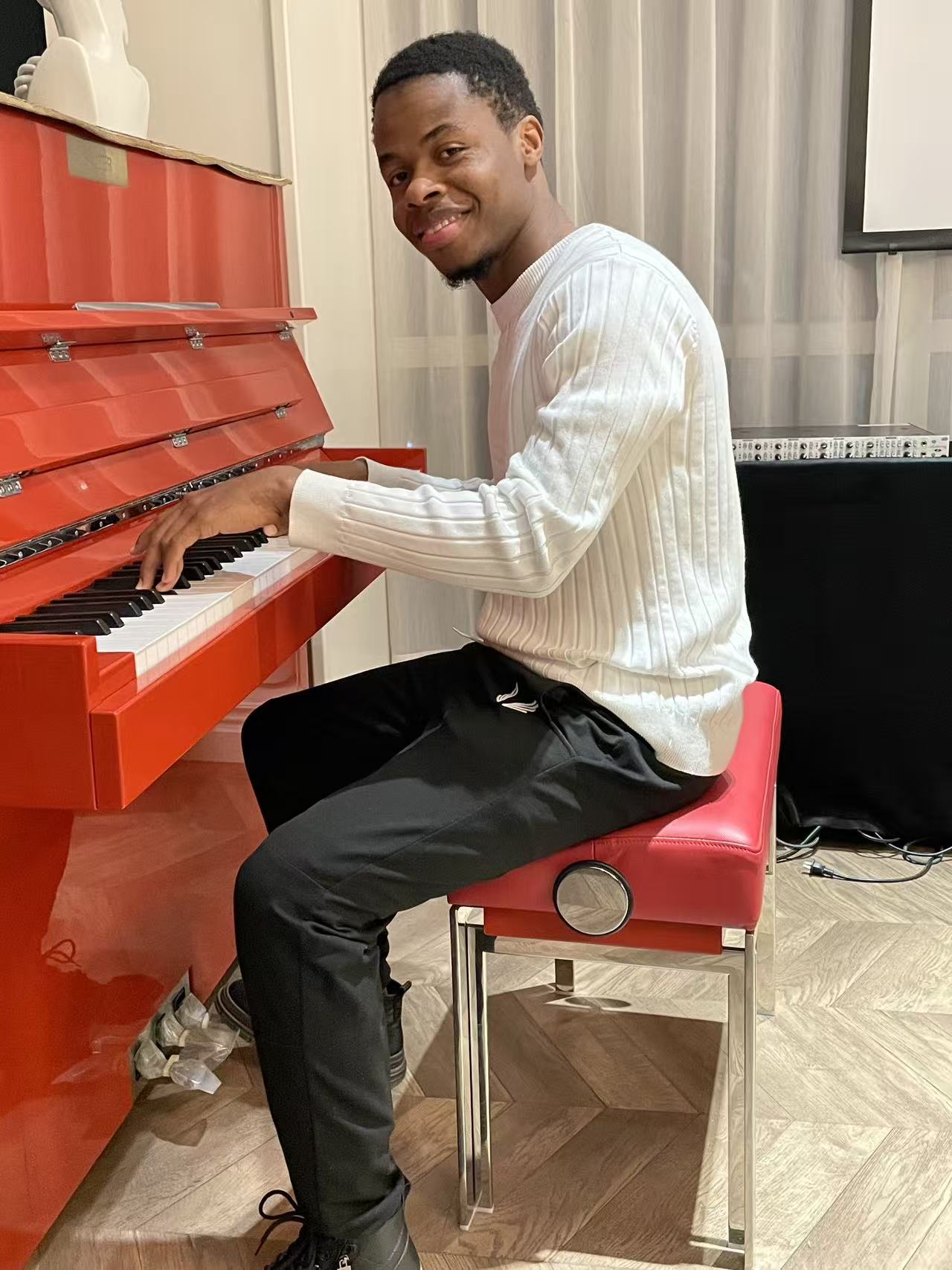 Enoch Kwateh Dongbo at the grand piano